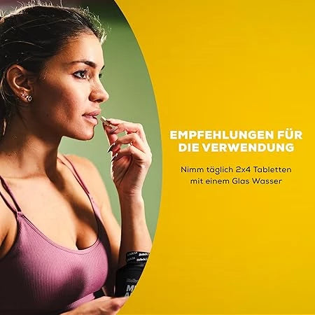 Sportliche Frau nimmt Nahrungsergänzungsmittel zur Unterstützung ihres Trainings.