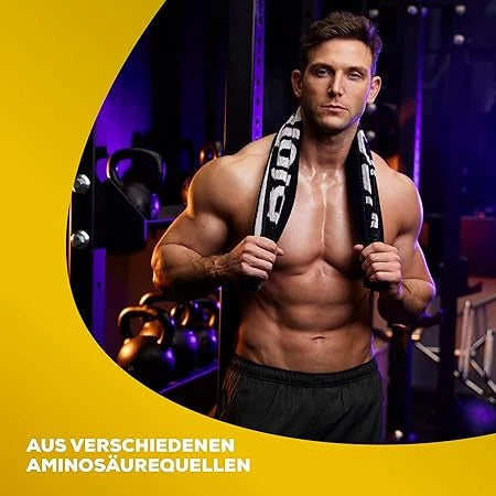 Muskulöser Mann mit Handtuch im Fitnessstudio, Fokus auf Bauchmuskeln und Oberkörper.