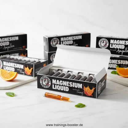 Supplement Support Magnesium Liquid Ampullen mit Orangenaroma auf weißem Marmor-Hintergrund
